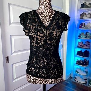 Lace shoulder length sleeved tank. See-through except for breast area